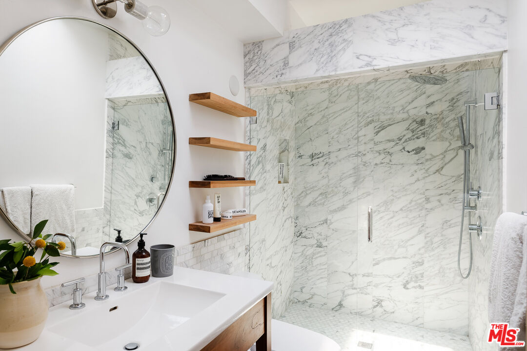 26237 Fairside Road Malibu, CA 90265 - Photo 34 of 34 a bathroom with a sink and a mirror