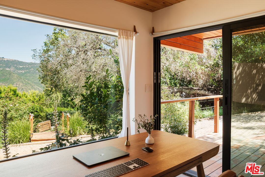 26237 Fairside Road Malibu, CA 90265 - Photo 5 of 34 a view of a living room and floor to ceiling window