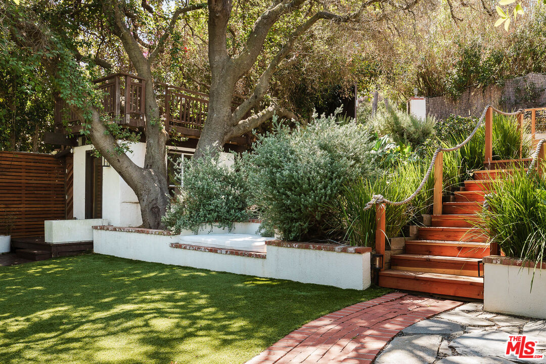 26237 Fairside Road Malibu, CA 90265 - Photo 7 of 34 a view of a house with backyard and sitting area