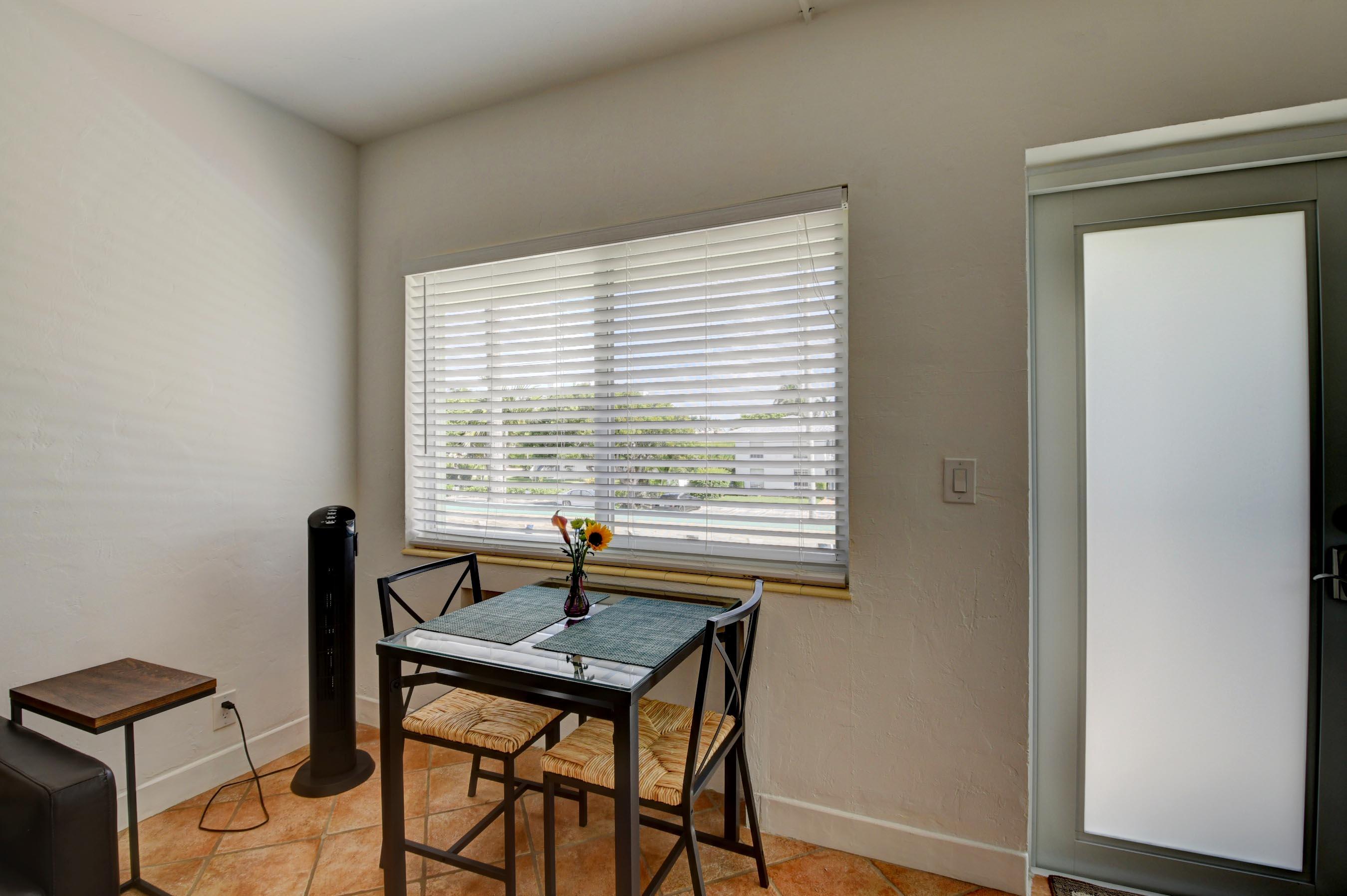1006 Casuarina Road, Unit 8 Delray Beach, FL 33483 - Photo 11 of 19 a view of a workspace with furniture and a window