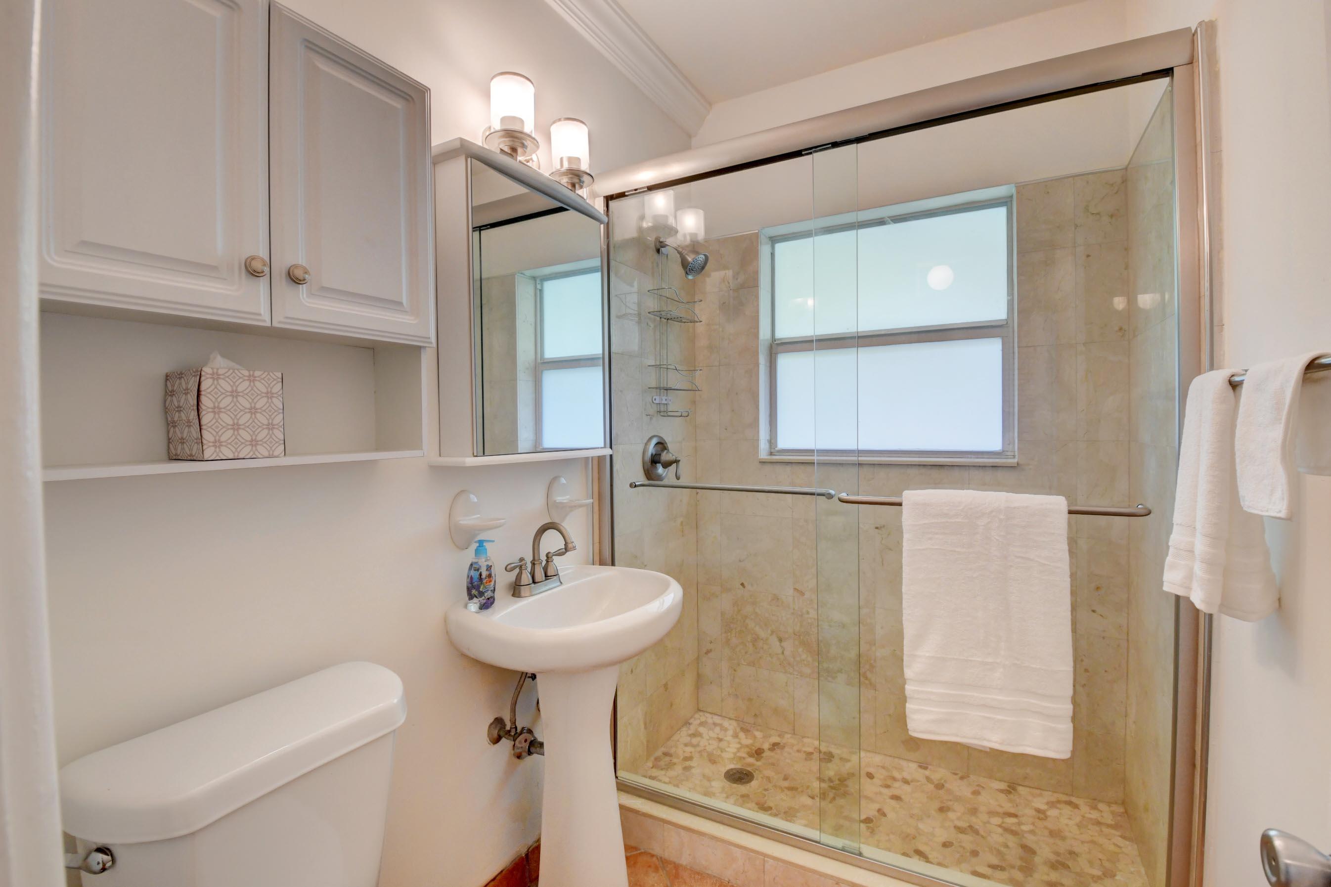 1006 Casuarina Road, Unit 8 Delray Beach, FL 33483 - Photo 17 of 19 a bathroom with a sink toilet and shower