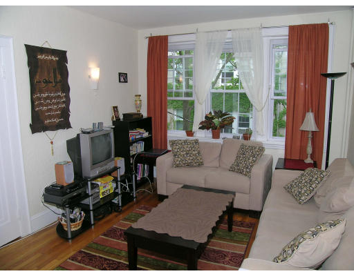 90 Kilsyth Road, Unit 33 Boston, MA 02135 - Photo 2 of 8 a living room with furniture and a window