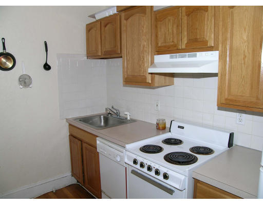 90 Kilsyth Road, Unit 33 Boston, MA 02135 - Photo 4 of 8 a kitchen with a stove and a sink