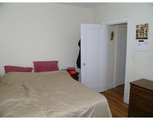 90 Kilsyth Road, Unit 33 Boston, MA 02135 - Photo 5 of 8 a bedroom with a bed and a dresser