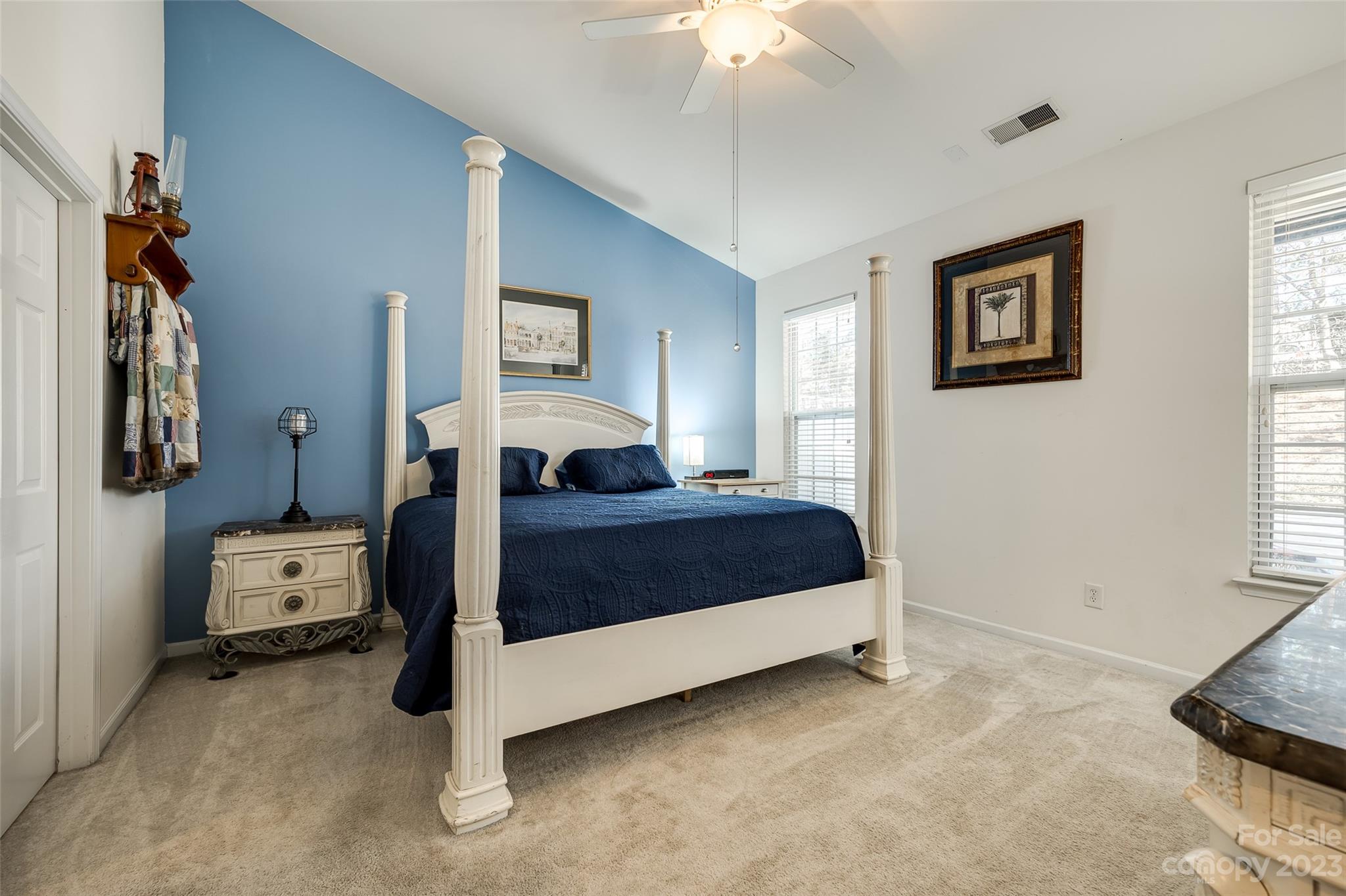 1659 Onyx Ridge Fort Mill, SC 29708 - Photo 12 of 42 a bedroom with a bed and a chandelier