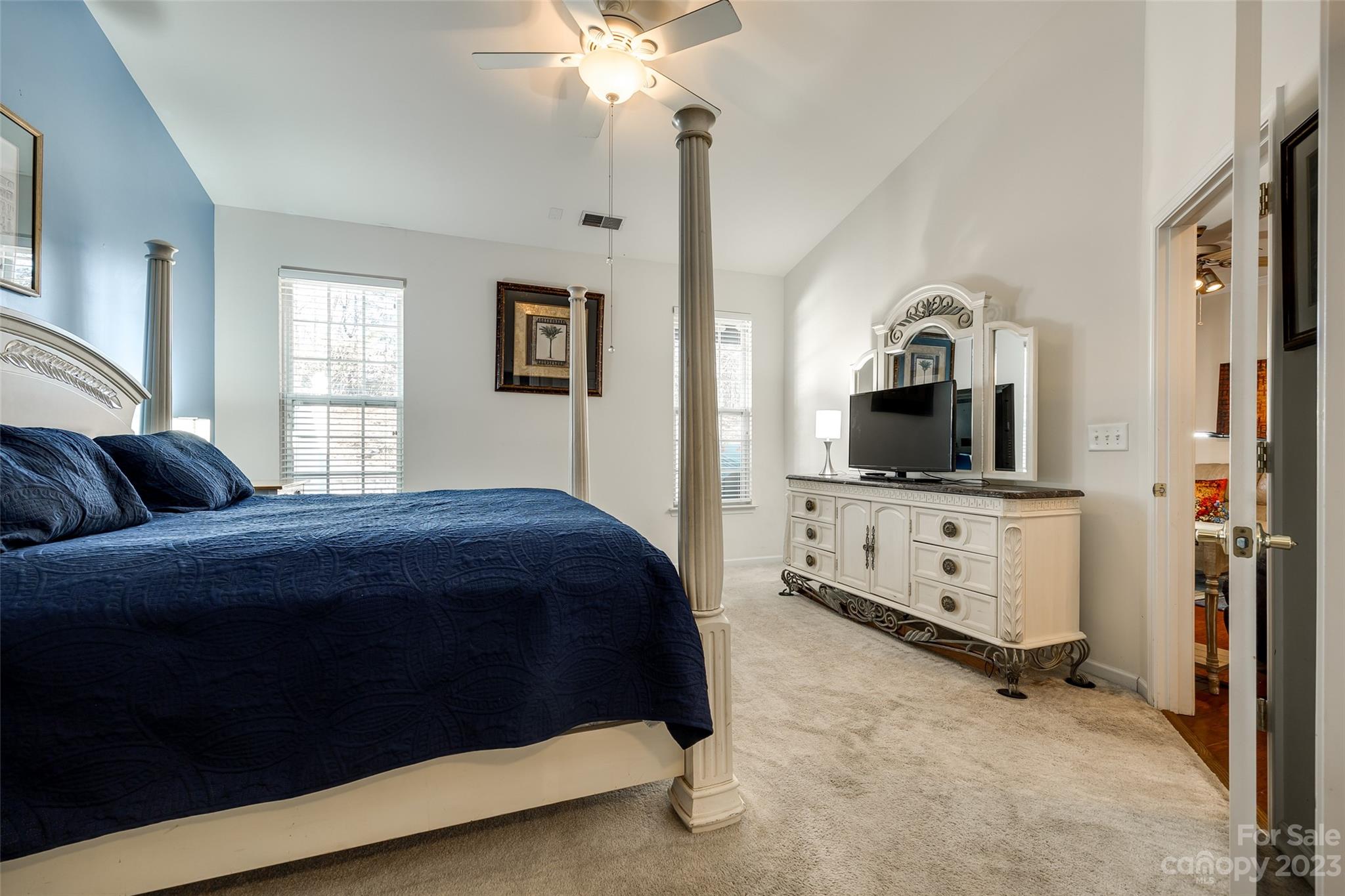 1659 Onyx Ridge Fort Mill, SC 29708 - Photo 14 of 42 a bedroom with a bed and flat screen tv