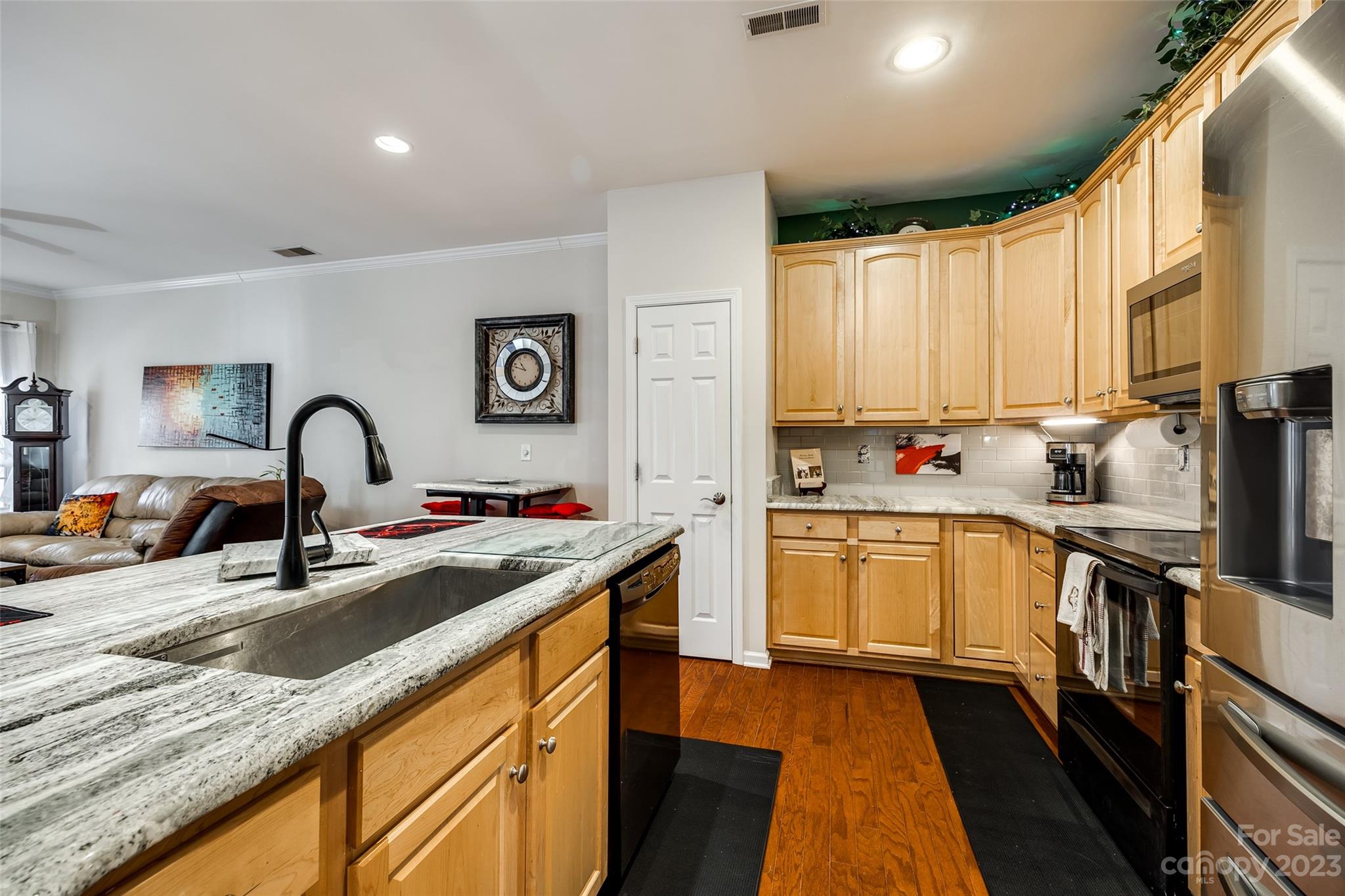 1659 Onyx Ridge Fort Mill, SC 29708 - Photo 18 of 42 a kitchen with stainless steel appliances granite countertop a sink stove and cabinets