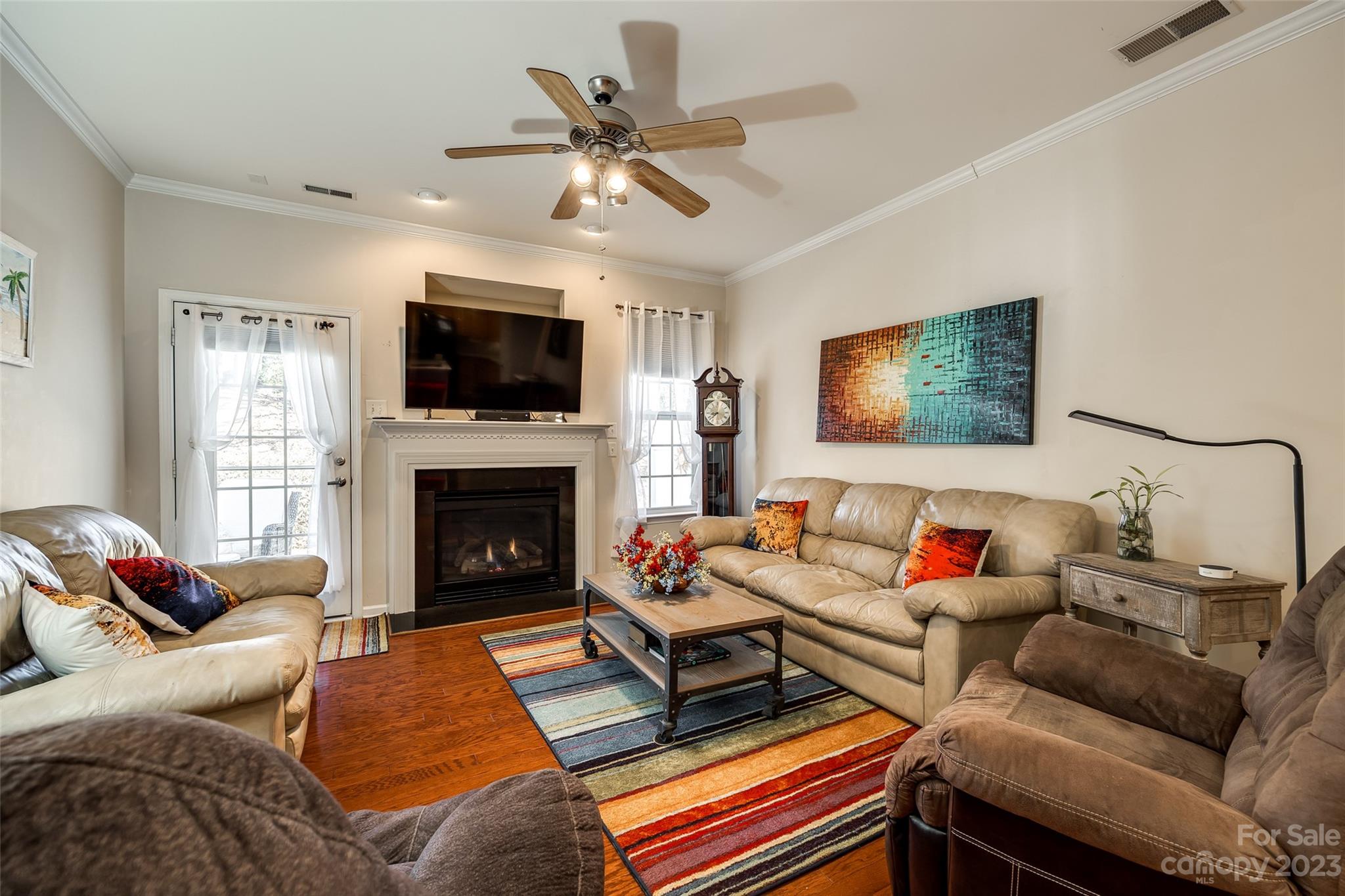 1659 Onyx Ridge Fort Mill, SC 29708 - Photo 21 of 42 a living room with furniture a flat screen tv and a fireplace