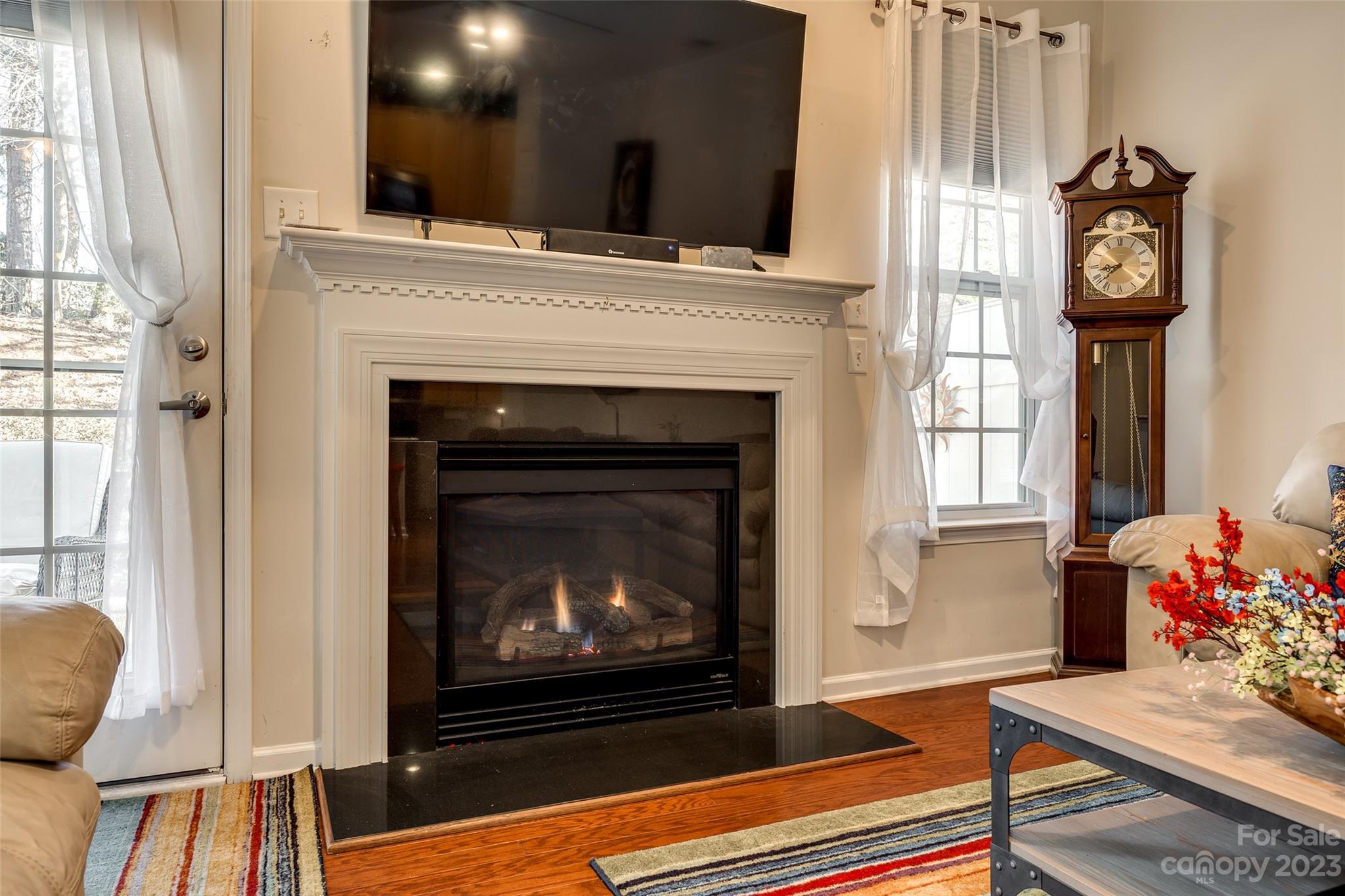 1659 Onyx Ridge Fort Mill, SC 29708 - Photo 23 of 42 a living room with furniture and a fireplace