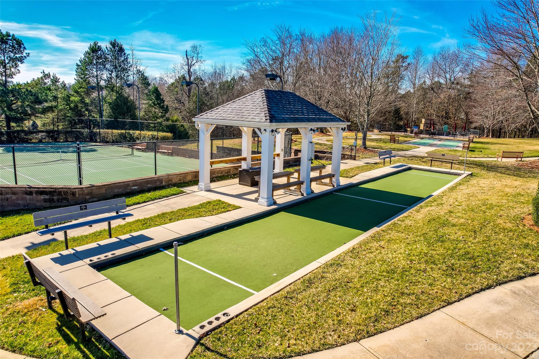 1659 Onyx Ridge Fort Mill, SC 29708 - Photo 40 of 42 a view of a tennis ground with large trees