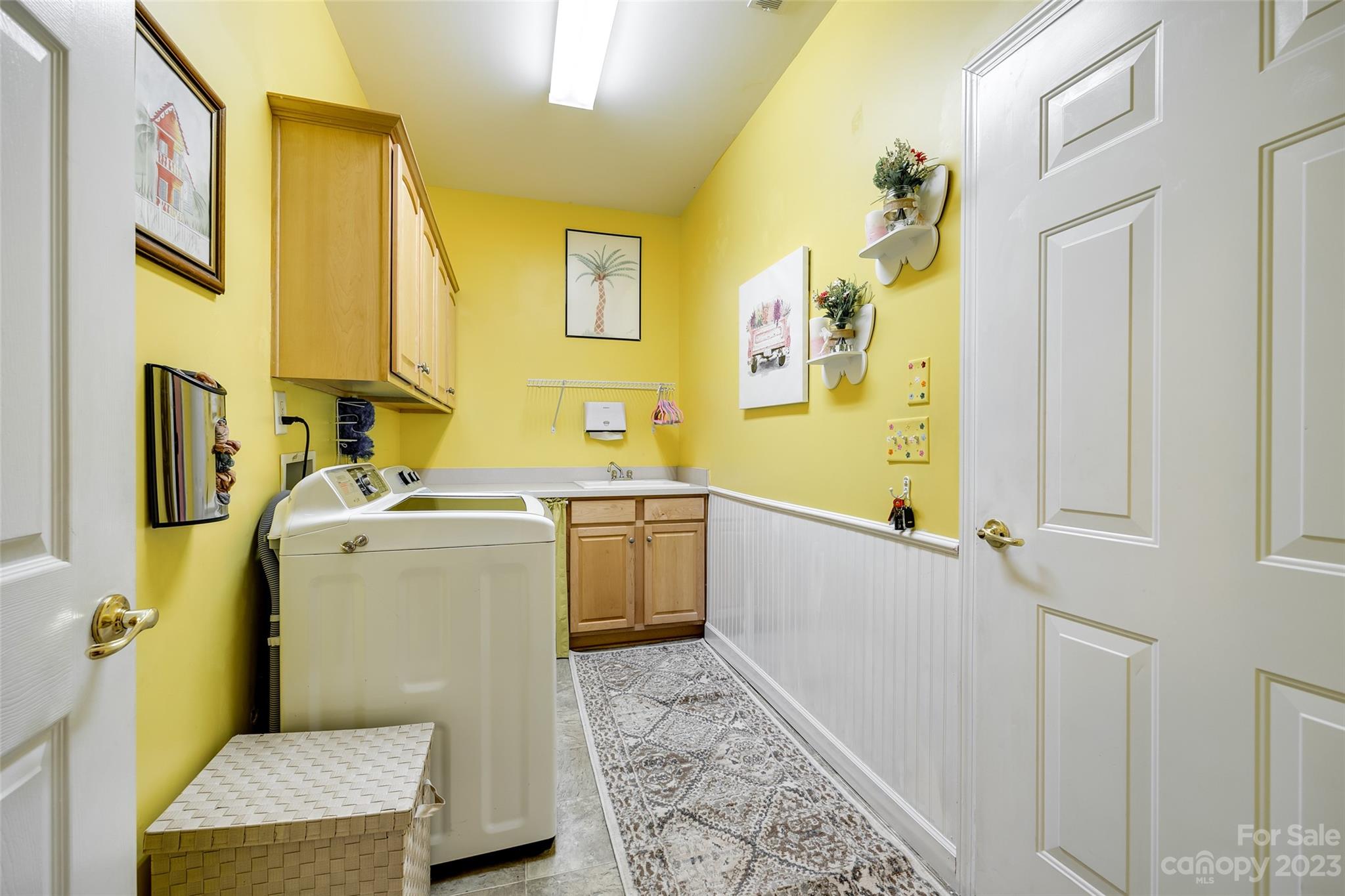 1659 Onyx Ridge Fort Mill, SC 29708 - Photo 8 of 42 a utility room with a sink a washer and dryer