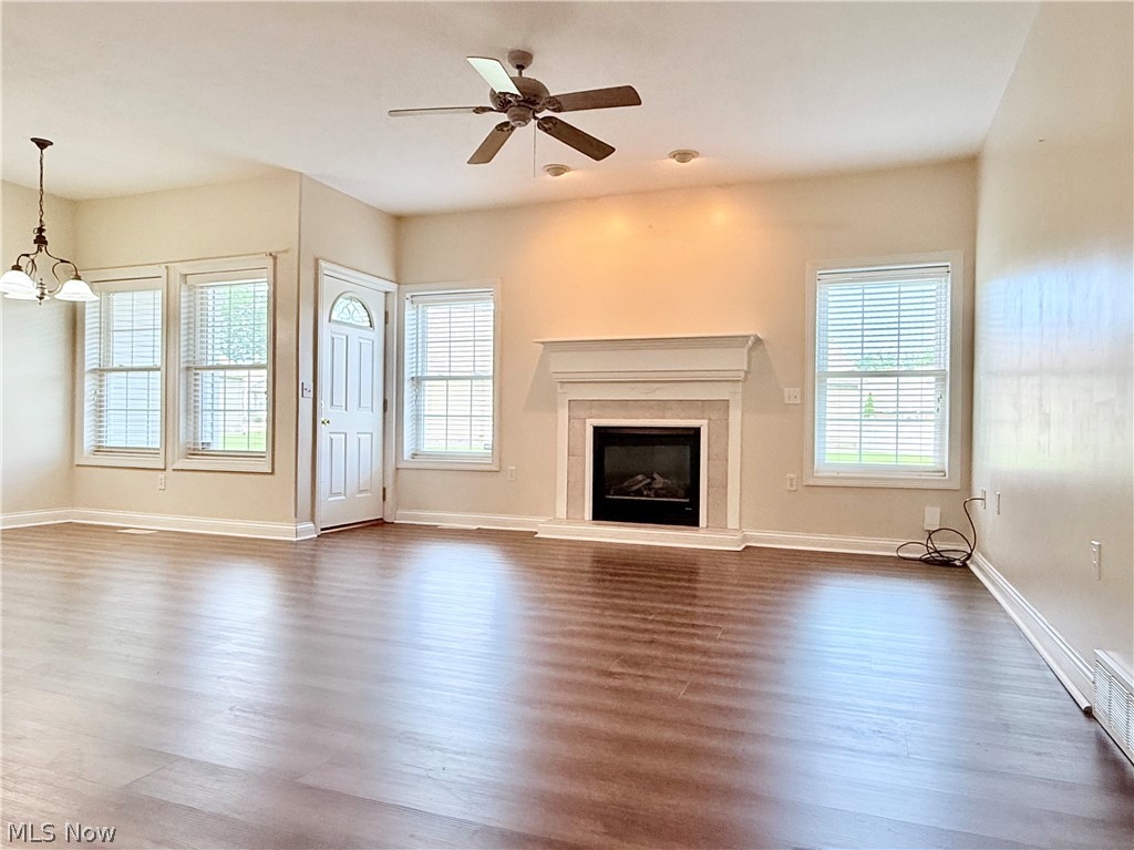 603 South Raccoon Road, Unit 1 Austintown, OH 44515 - Photo 4 of 22 Spacious living area featuring wood-finish flooring, a ceiling fan, and recessed lighting