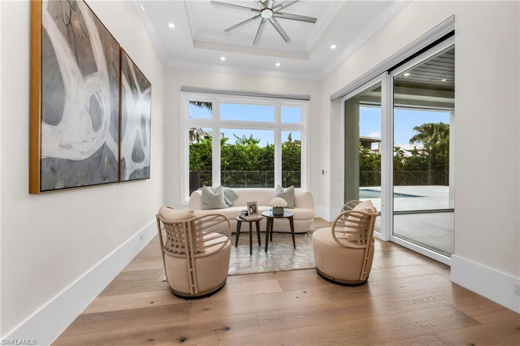3190 Crayton Road Naples, FL 34103 - Photo 15 of 48 a living room with furniture and a large window with outer view