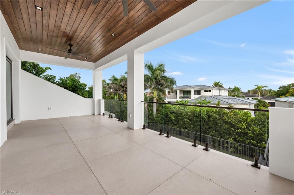 3190 Crayton Road Naples, FL 34103 - Photo 26 of 48 a view of a porch