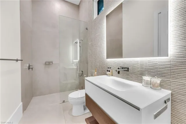 a picture of a bathroom with a shower