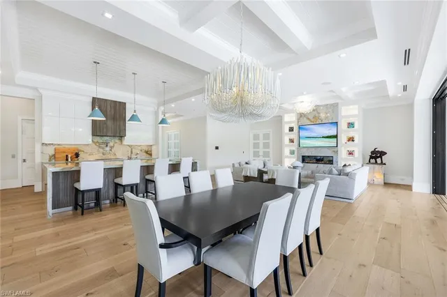 a living room with furniture and a large window with outer view