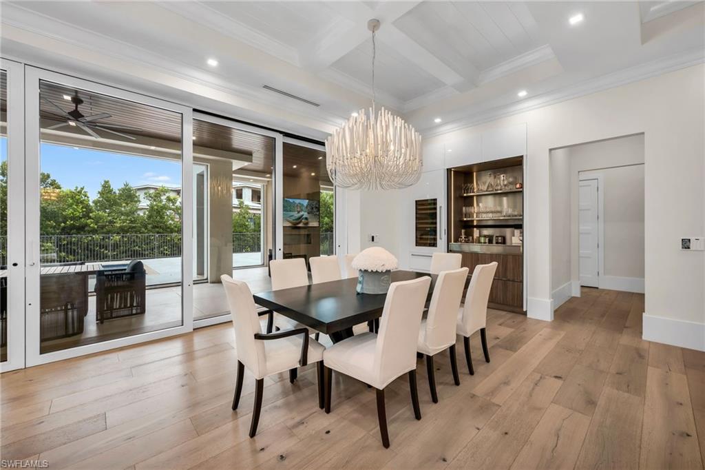 3190 Crayton Road Naples, FL 34103 - Photo 9 of 45 Dining room with bar & sub zero fridge