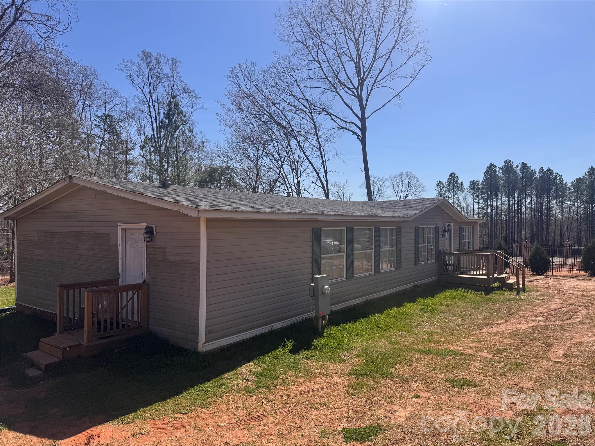 232 Fern Hill Road Troutman, NC 28166 - Photo 3 of 12 a view of a house with a yard and sitting area