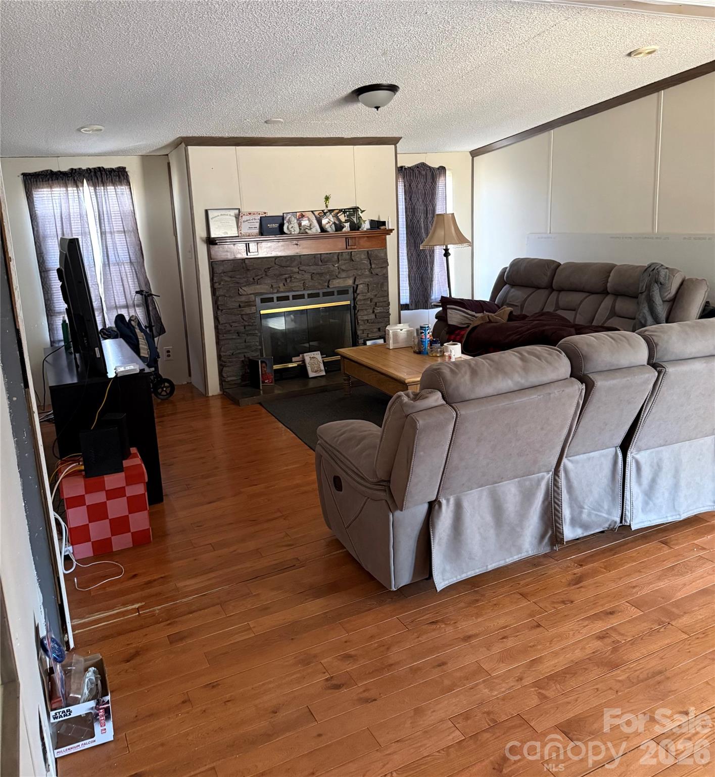 232 Fern Hill Road Troutman, NC 28166 - Photo 4 of 12 a living room with furniture and a flat screen tv