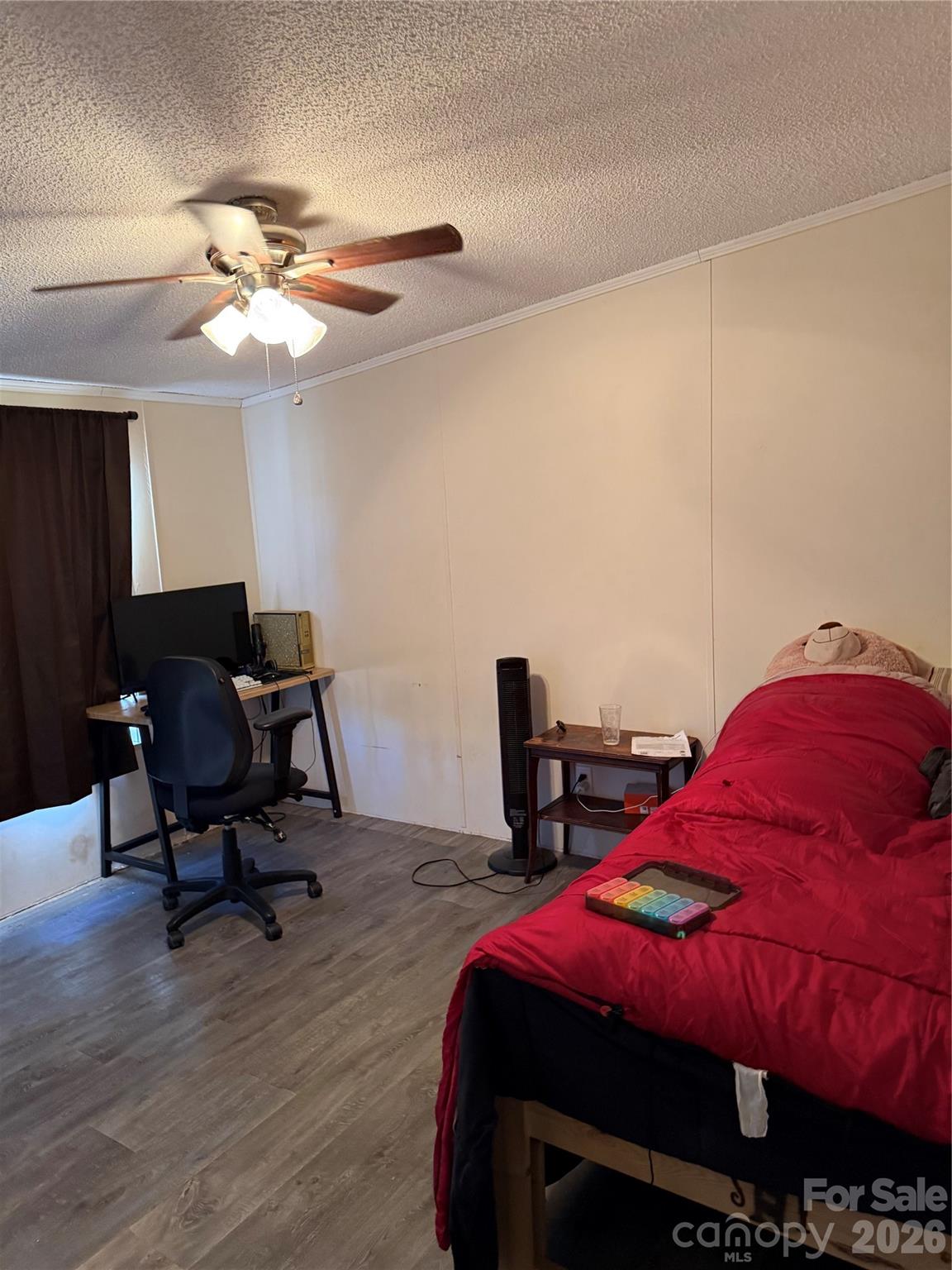 232 Fern Hill Road Troutman, NC 28166 - Photo 7 of 12 a bed room with a bed and a chair