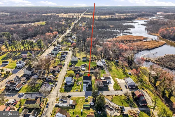 an aerial view of residential building and lake