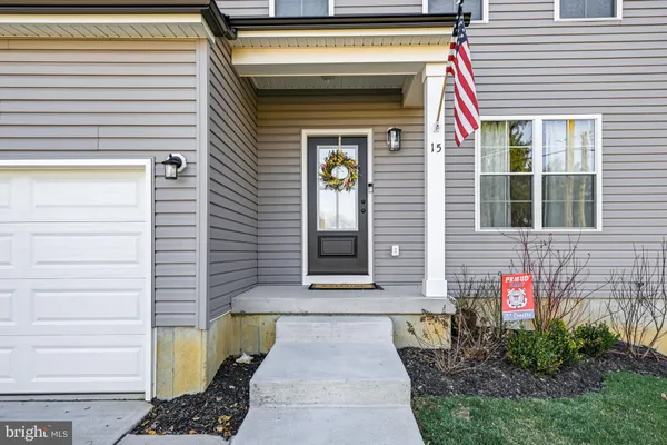 a front view of a house with outdoor space