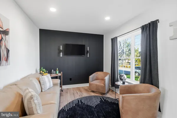 a living room with furniture and a window