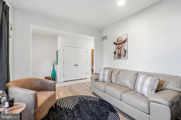 a bedroom with furniture and a couch