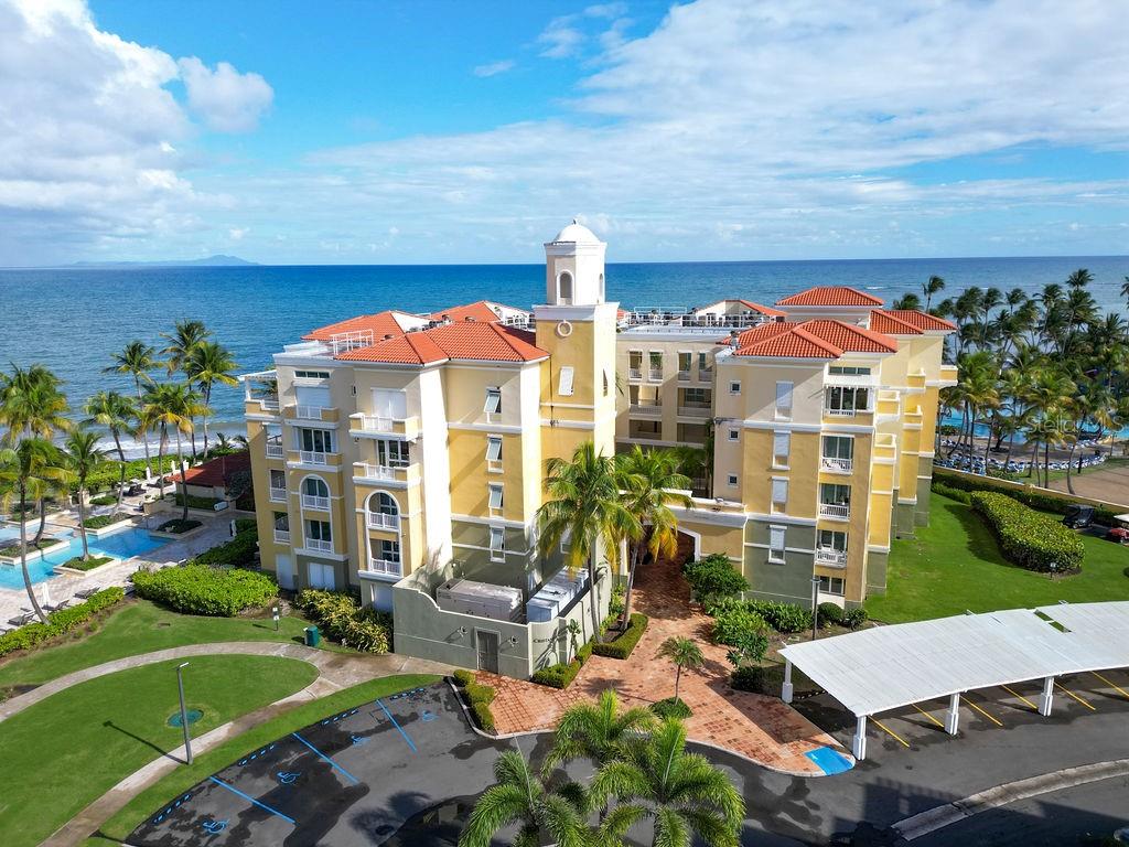 200 Ocean Drive, Unit 215 Humacao, PR 00791 - Photo 1 of 1 an aerial view of a house with a garden and lake view