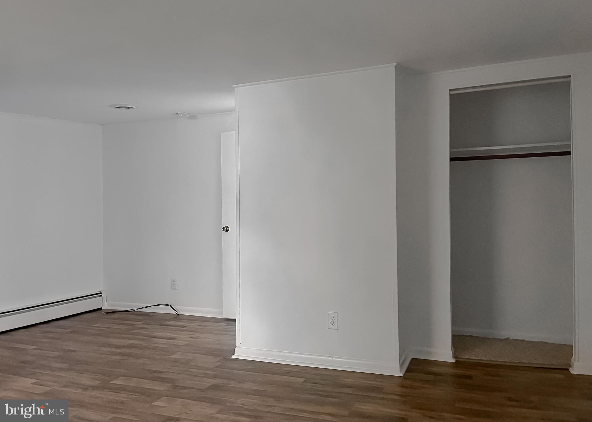 37117 Moore Road Bushwood, MD 20618 - Photo 19 of 45 a view of an empty room with wooden floor and a window
