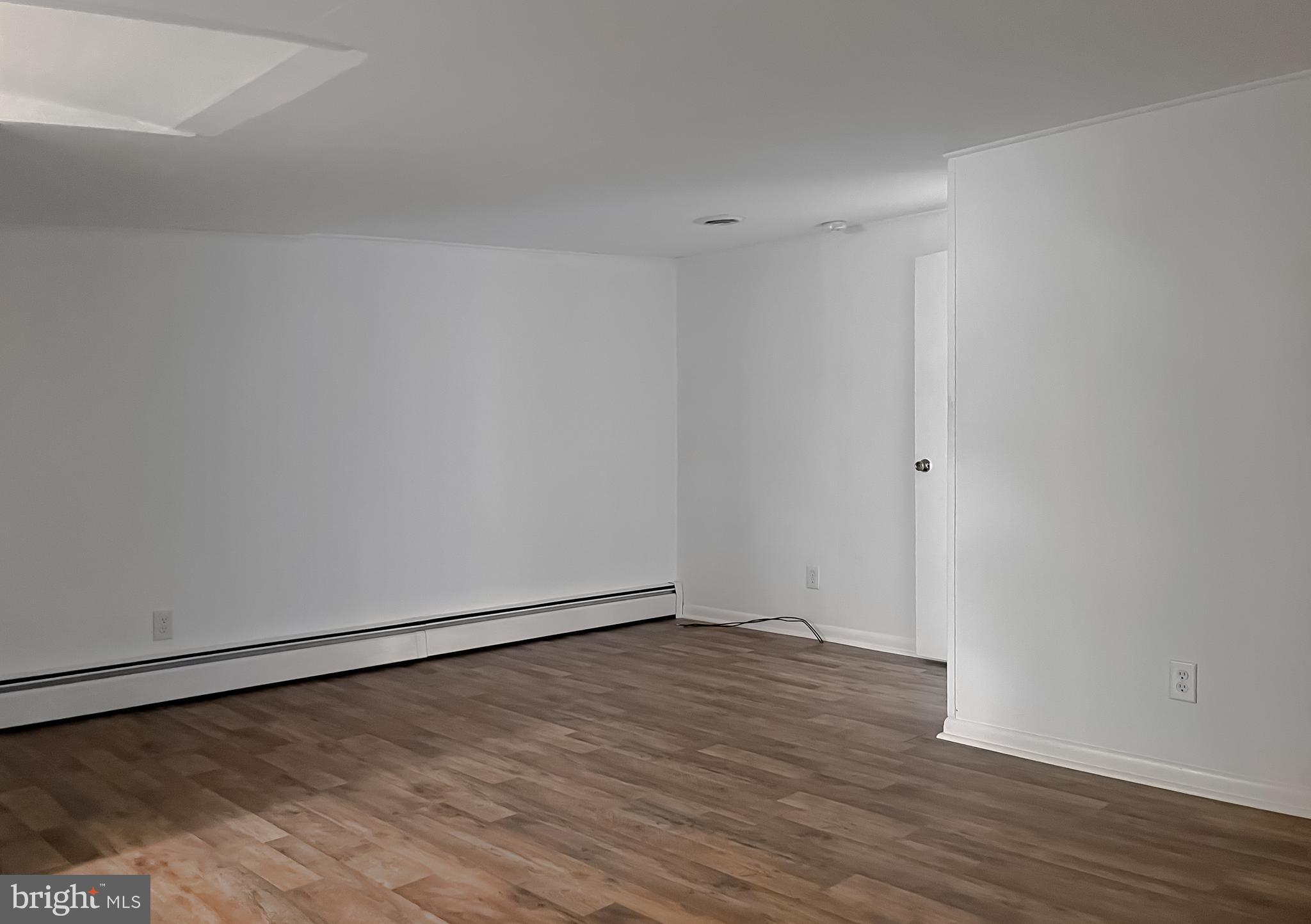 37117 Moore Road Bushwood, MD 20618 - Photo 20 of 45 a view of an empty room with wooden floor