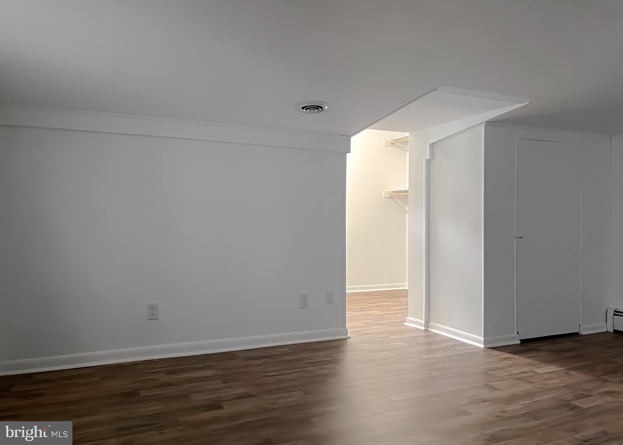 37117 Moore Road Bushwood, MD 20618 - Photo 21 of 45 a view of an empty room with wooden floor and a window