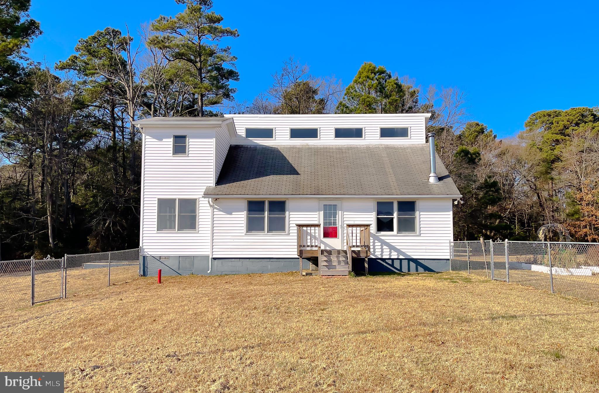 37117 Moore Road Bushwood, MD 20618 - Photo 3 of 45 a front view of a house with a yard