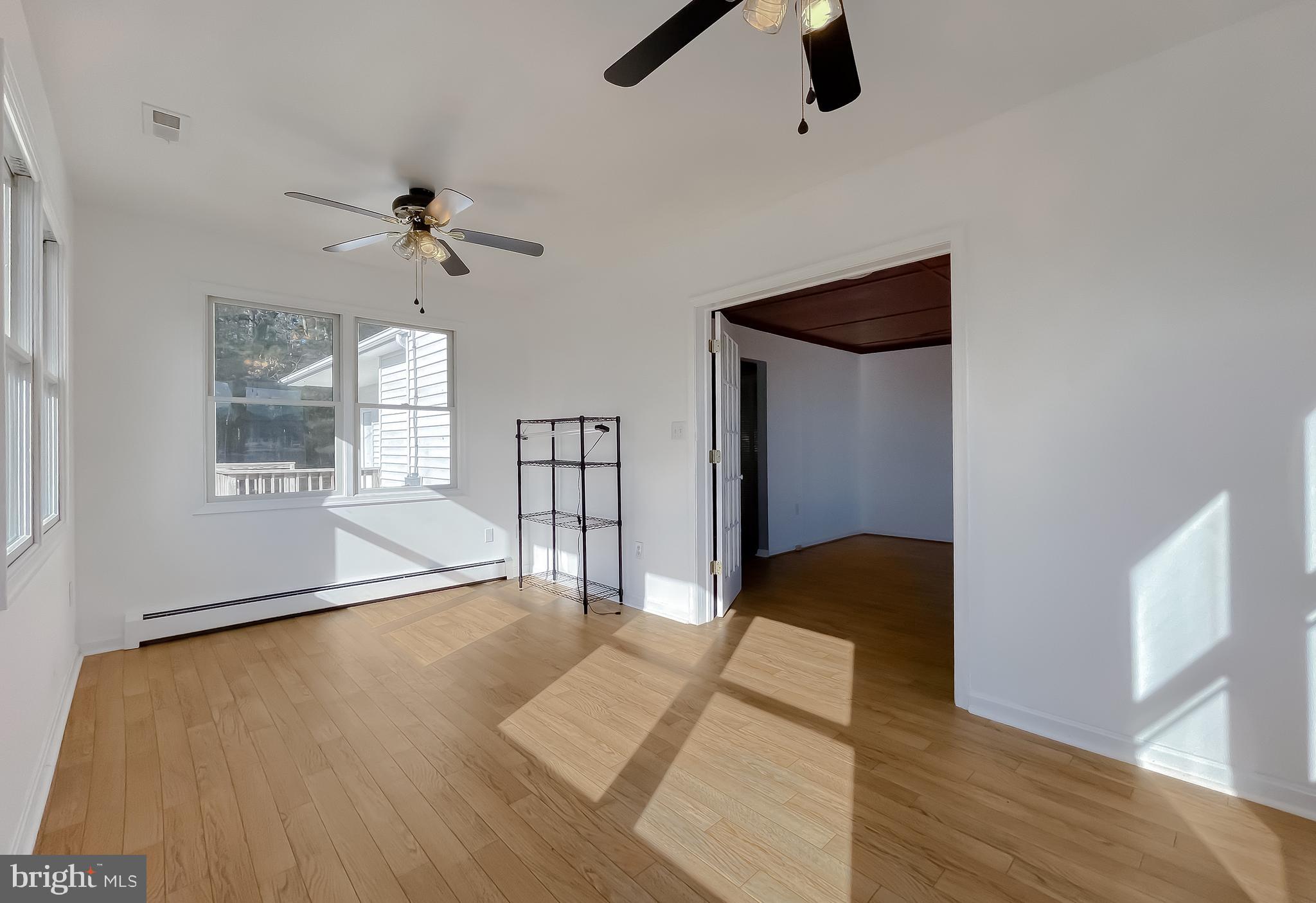 37117 Moore Road Bushwood, MD 20618 - Photo 33 of 45 wooden floor in an empty room with a window