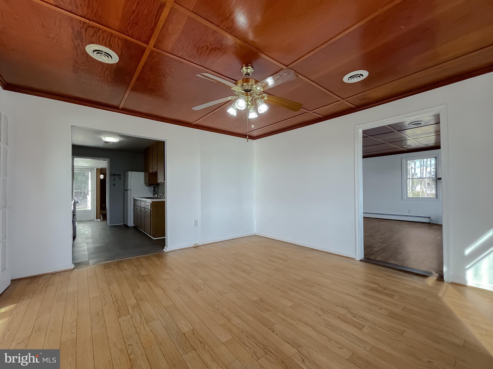 37117 Moore Road Bushwood, MD 20618 - Photo 36 of 45 a view of empty room with wooden floor and fan
