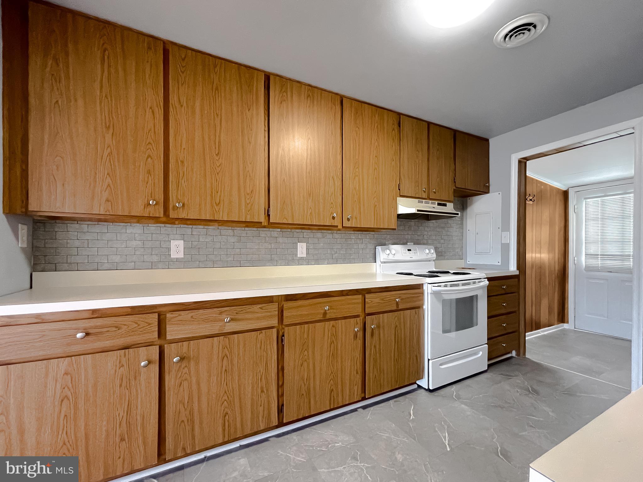 37117 Moore Road Bushwood, MD 20618 - Photo 41 of 45 a kitchen with stainless steel appliances granite countertop a sink and cabinets