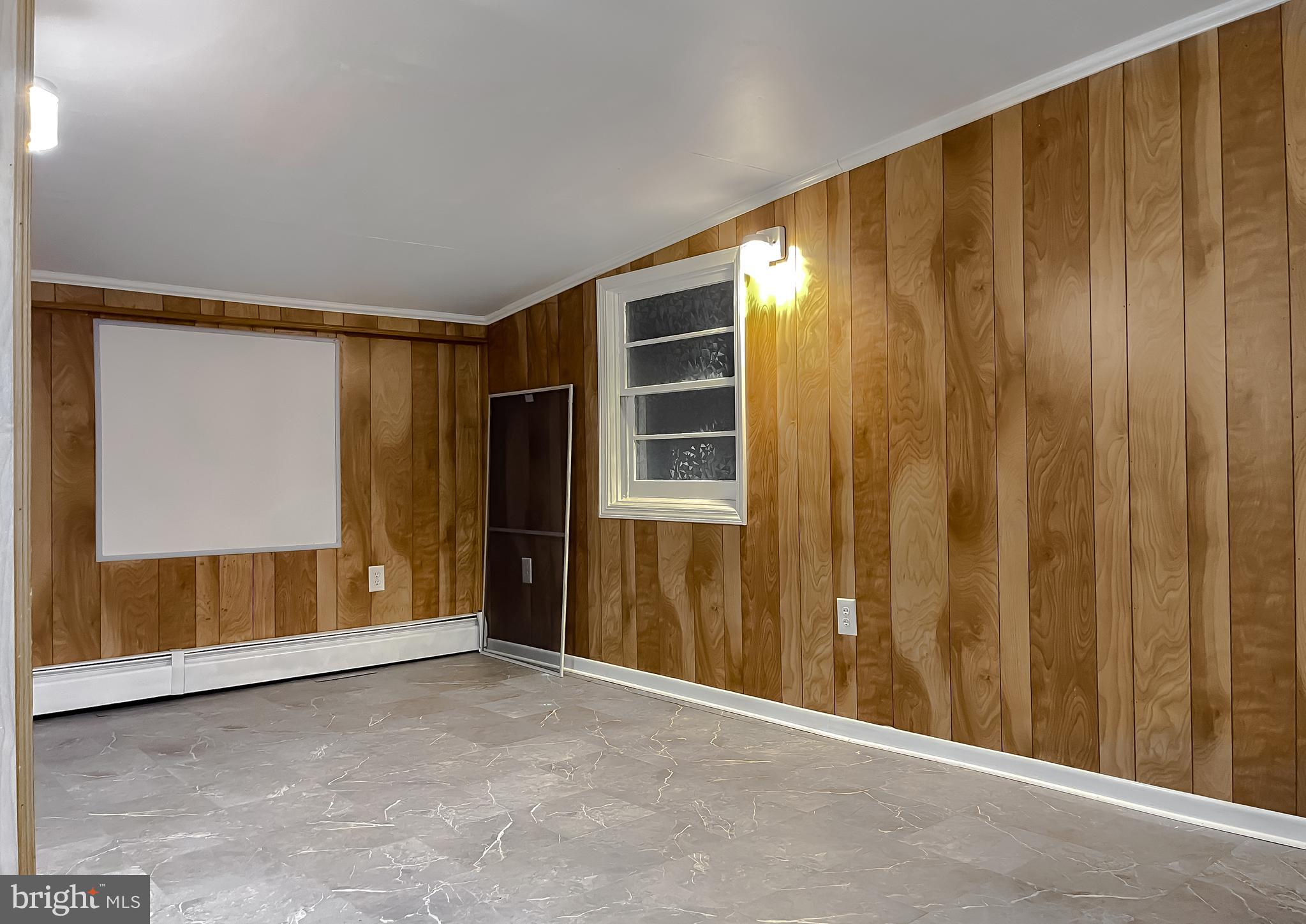 37117 Moore Road Bushwood, MD 20618 - Photo 42 of 45 a view of an empty room with wooden walls