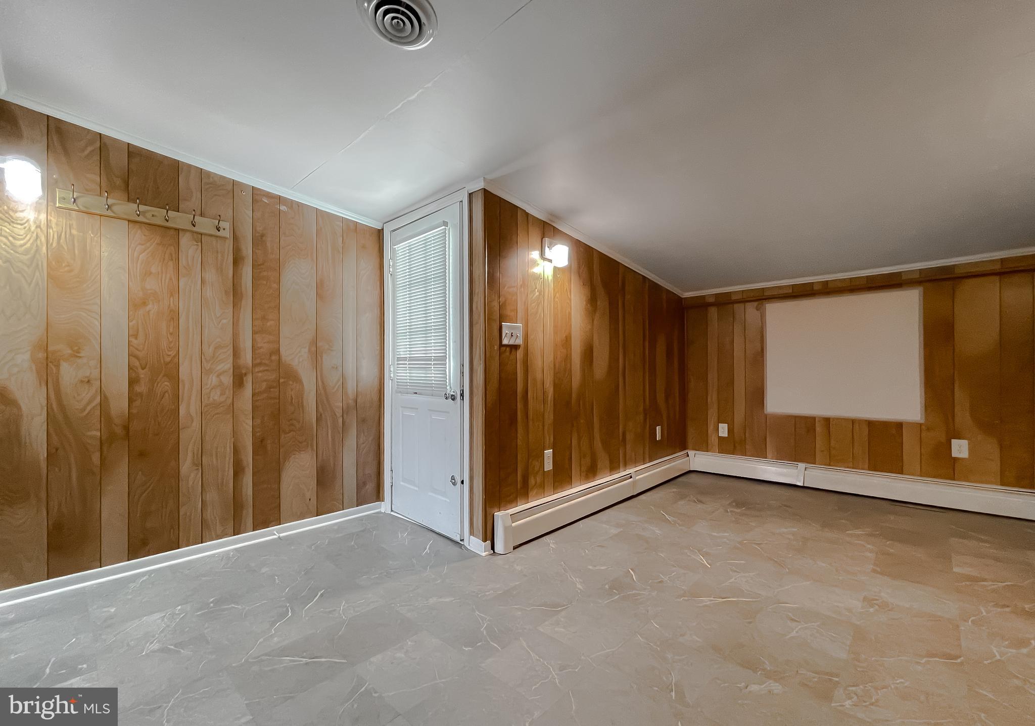 37117 Moore Road Bushwood, MD 20618 - Photo 43 of 45 a view of an empty room with wooden door