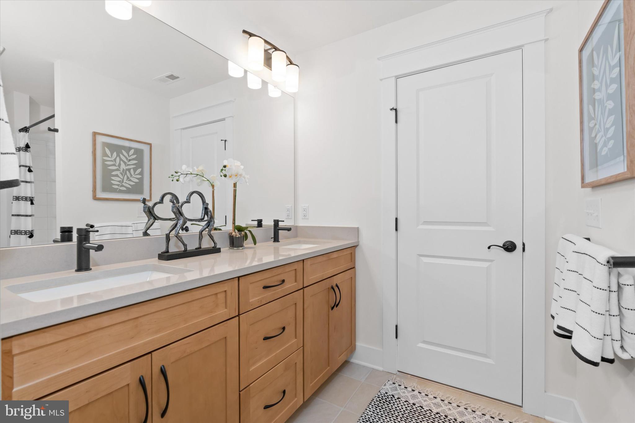 24105 Jerrico Road, Unit 26 Lincoln, DE 19960 - Photo 28 of 52 a bathroom with double vanity sink and a mirror
