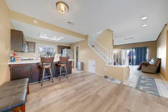 a bedroom with furniture and a wooden floor