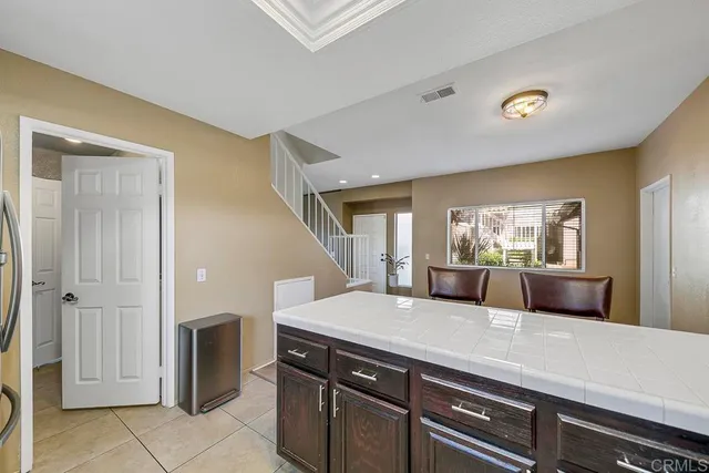 a view of living room with granite countertop furniture and fireplace