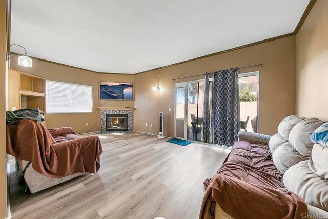 a spacious bedroom with a bed a couch and dresser