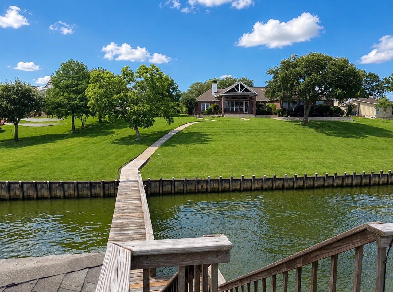 430 Fawn Road Livingston, TX 77351 - Photo 30 of 47 a view of a lake with a garden