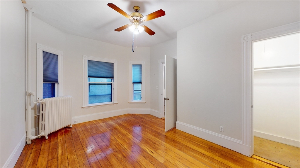 119 Park Street, Unit 3 Brookline, MA 02446 - Photo 1 of 10 a view of an empty room with window and cabinet