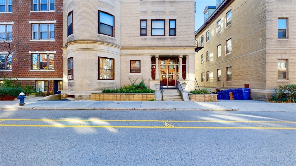 119 Park Street, Unit 3 Brookline, MA 02446 - Photo 9 of 10 a view of a building with a swimming pool
