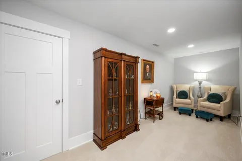 a bedroom with furniture and a lamp