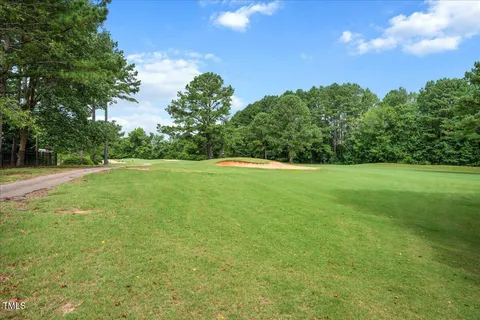 a view of a green field with clear sky