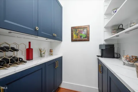 a kitchen with a sink cabinets and appliances