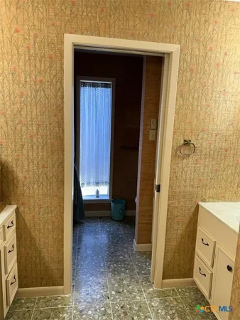 a view of bathroom with a sink and a shower