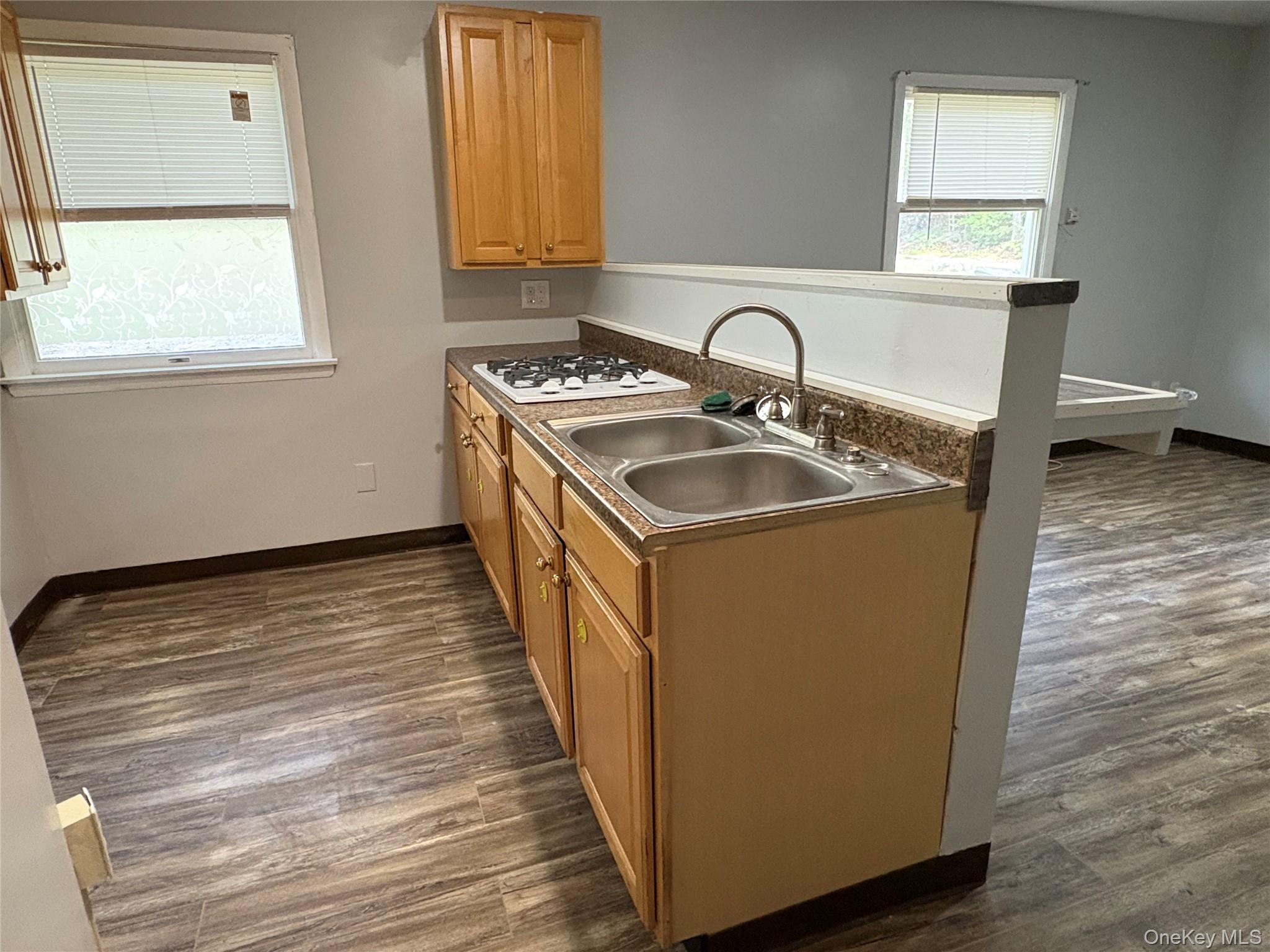 a kitchen with sink and window